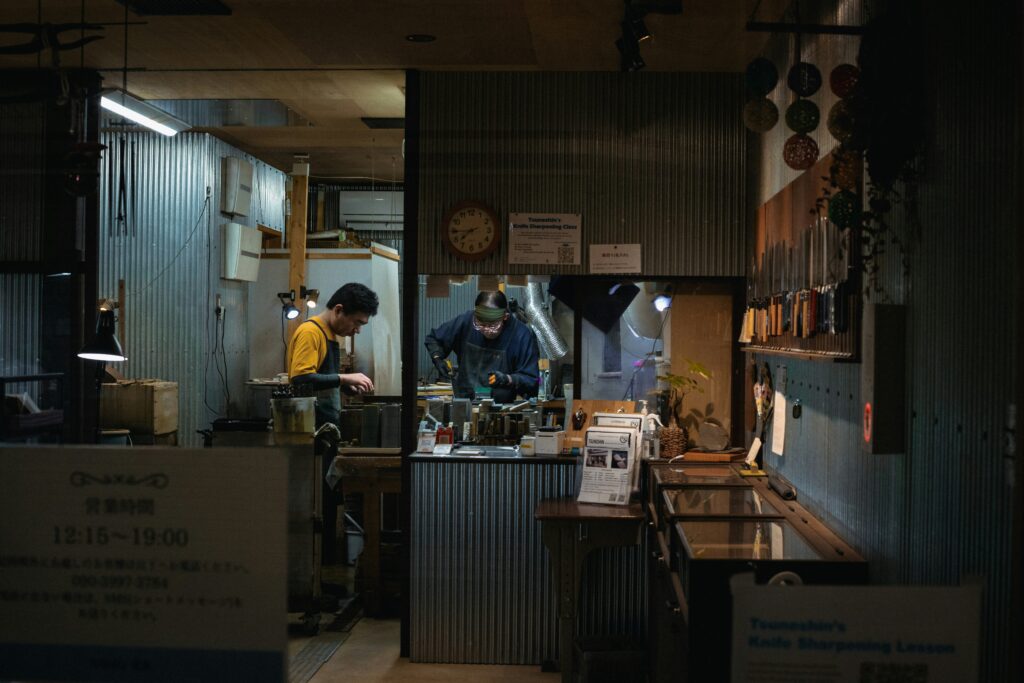 Two people working together in a practical workshop